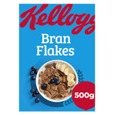 A 500g box of Kellogg's Bran Flakes—nutritious cereal shown with banana slices and blueberries on a blue background—makes the perfect breakfast to start your day.